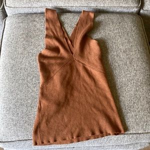 I’m selling a brown cross back tank top in perfect condition.